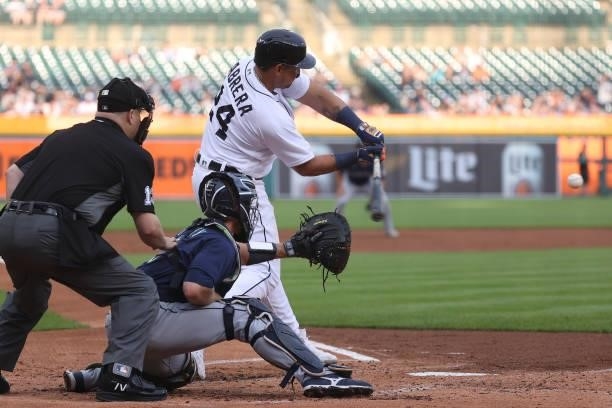Miguel Cabrera of the Detroit Tigers hits a first inning single that scores a run in front of Tom Murphy of the Seattle Mariners at Comerica Park on...
