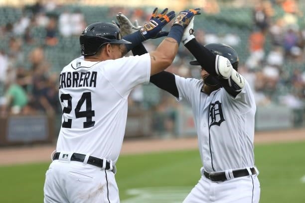 Eric Haase of the Detroit Tigers celebrates his first inning two run home run with Miguel Cabrera while playing the Seattle Mariners at Comerica Park...