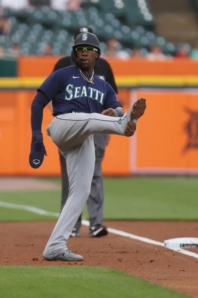 Shed Long Jr. #4 of the Seattle Mariners stops a third base in the second inning while playing the Detroit Tigers at Comerica Park on June 08, 2021...