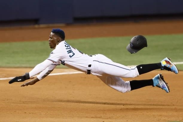Jazz Chisholm Jr. #2 of the Miami Marlins slides into third base against the Colorado Rockies during the seventh inning at loanDepot park on June 08,...