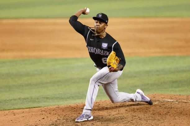 Yency Almonte of the Colorado Rockies delivers a pitch during the eighth inning against the Miami Marlins at loanDepot park on June 08, 2021 in...