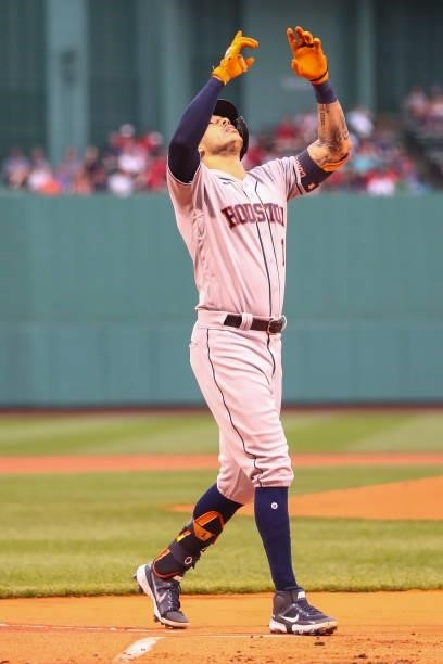 Carlos Correa of the Houston Astros reacts as he crosses home plate after hitting a solo home run in the first inning of a game against the Boston...