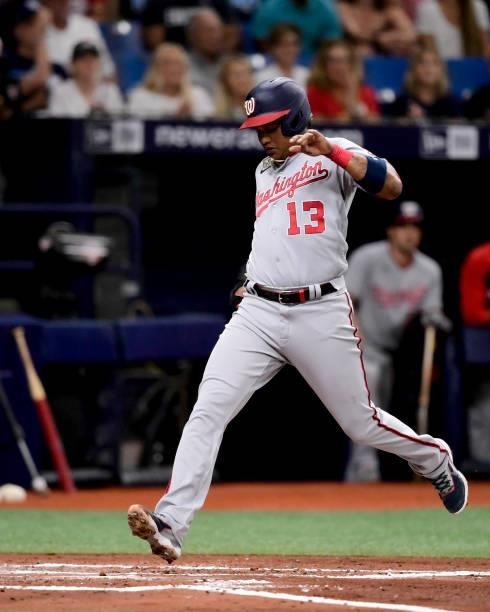 Starlin Castro of the Washington Nationals scores on an RBI single from the bat of Trea Turner during the third inning against the Tampa Bay Rays at...