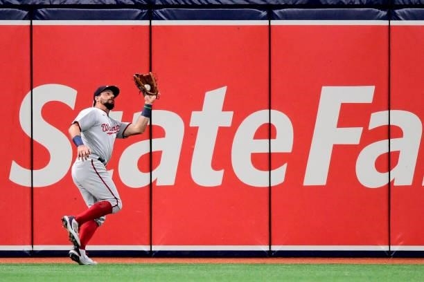 Kyle Schwarber of the Washington Nationals catches a fly ball during the fourth inning against the Tampa Bay Rays at Tropicana Field on June 08, 2021...