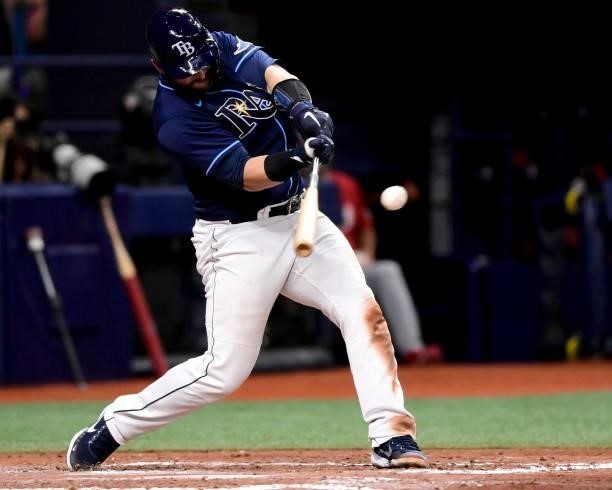 Mike Zunino of the Tampa Bay Rays hits an RBI single during the fifth inning against the Washington Nationals at Tropicana Field on June 08, 2021 in...