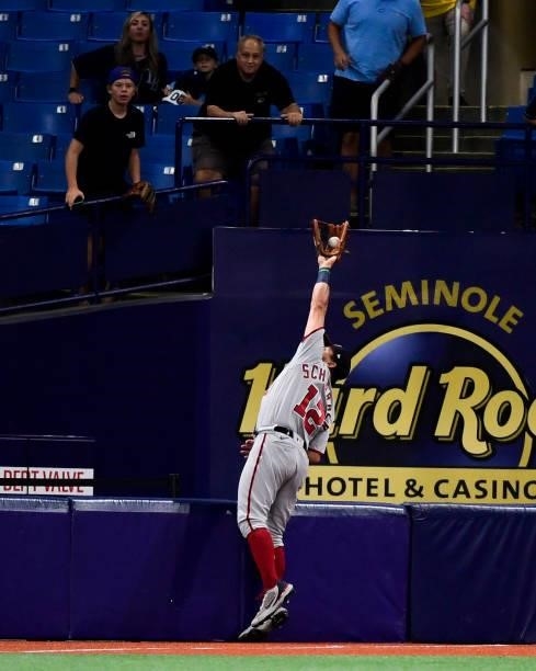 Kyle Schwarber of the Washington Nationals catches a fly ball during the fifth inning against the Tampa Bay Rays at Tropicana Field on June 08, 2021...