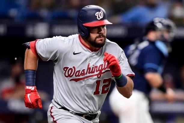 Kyle Schwarber of the Washington Nationals runs to first base on a fielders choice during the eighth inning against the Tampa Bay Rays at Tropicana...