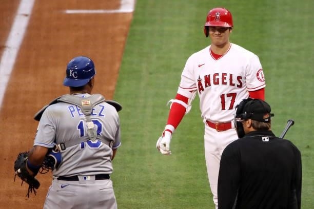 Shohei Ohtani of the Los Angeles Angels walks to home plate before his at bat during the first inning against the Kansas City Royals at Angel Stadium...