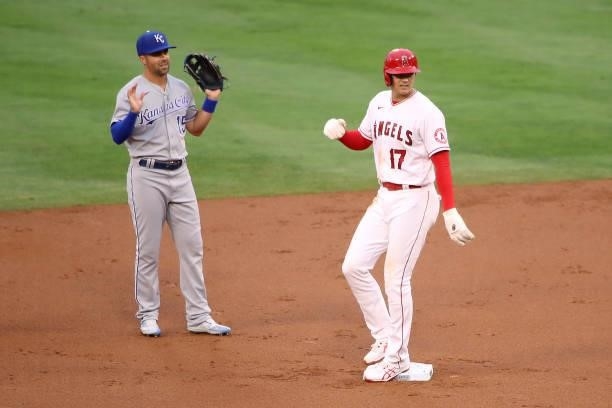 Shohei Ohtani of the Los Angeles Angels is safe at second base off a wild pitch against Whit Merrifield of the Kansas City Royals during the first...