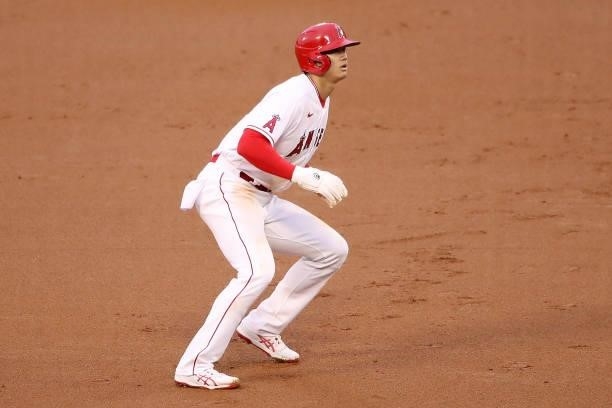 Shohei Ohtani of the Los Angeles Angels waits for the play at second base during the first inning against the Kansas City Royals at Angel Stadium of...