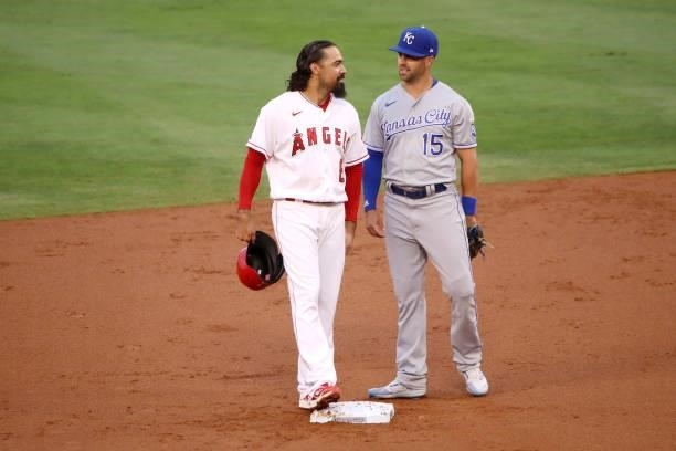 Anthony Rendon of the Los Angeles Angels and Whit Merrifield of the Kansas City Royals talk at second base during the first inning at Angel Stadium...