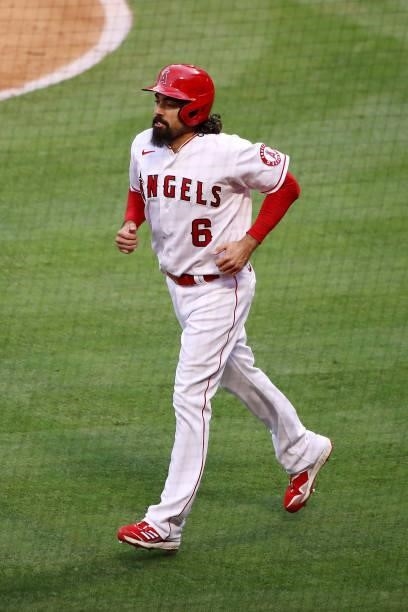 Anthony Rendon of the Los Angeles Angels jogs to the dugout after scoring off an RBI single by Max Stassi during the first inning against the Kansas...