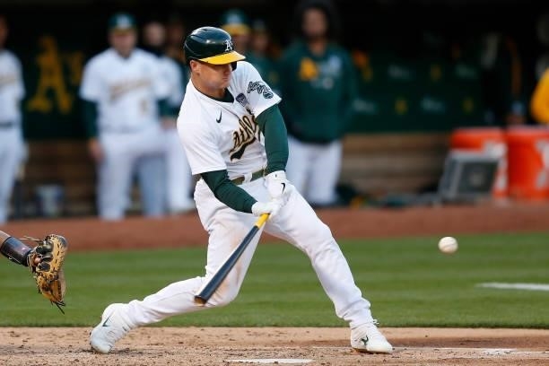 Matt Chapman of the Oakland Athletics hits an RBI single in the bottom of the fourth inning against the Arizona Diamondbacks at RingCentral Coliseum...