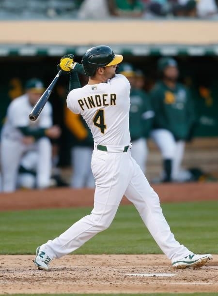 Chad Pinder of the Oakland Athletics hits an RBI single in the bottom of the fourth inning against the Arizona Diamondbacks at RingCentral Coliseum...