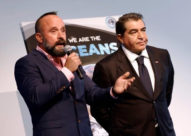 Photographer Michael Muller and Ambassador Paolo Zampolli on stage at the We Are The Oceans - The World Oceans Day event at The Reach at The Kennedy...