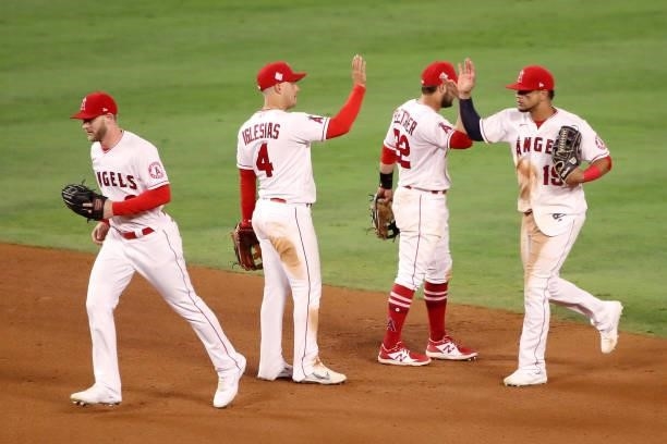 Taylor Ward, Jose Iglesias, David Fletcher, and Juan Lagares of the Los Angeles Angels celebrate their 8-3 win against the Kansas City Royals after...