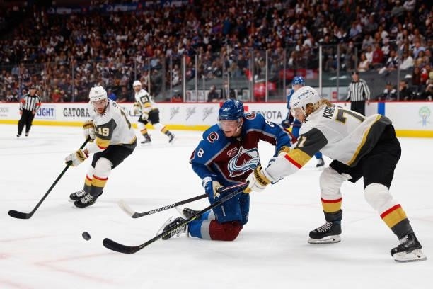 Cale Makar of the Colorado Avalanche goes down on the ice for the puck against William Karlsson of the Vegas Golden Knights during the second period...