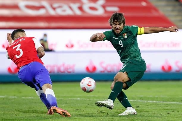 Marcelo Moreno Martins of Bolivia kicks the ball during a match between Chile and Bolivia as part of South American Qualifiers for Qatar 2022 at...