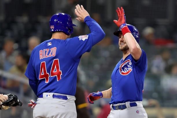 Anthony Rizzo congratulares Patrick Wisdom of the Chicago Cubs after his two-run homerun in the sixth inning of a game against the San Diego Padres...