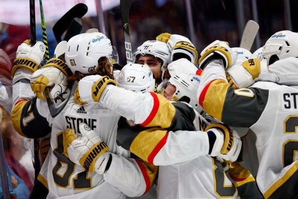 Mark Stone of the Vegas Golden Knights celebrates with his teammates 1after scoring against the Colorado Avalanche during overtime in Game Five of...