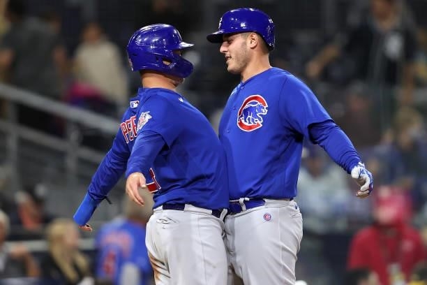 Joc Pederson congratulates Anthony Rizzo of the Chicago Cubs after his two-run homerun during the seventh inning of a game against the San Diego...