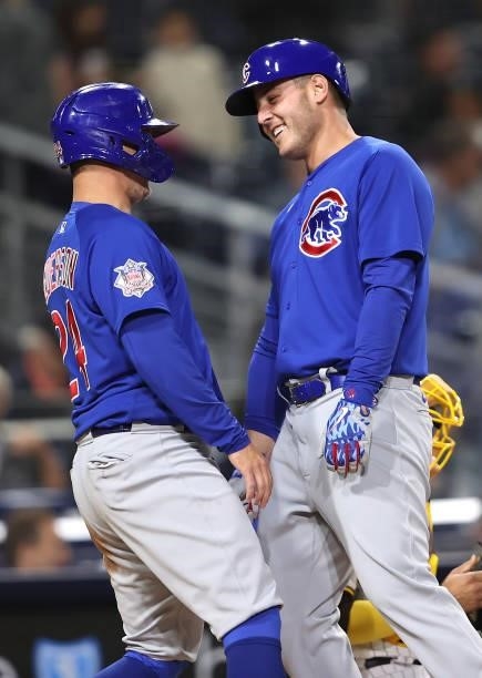 Joc Pederson congratulates Anthony Rizzo of the Chicago Cubs after his two-run homerun during the seventh inning of a game against the San Diego...