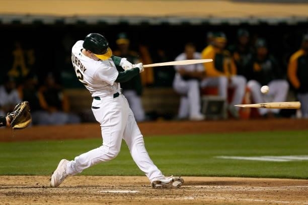 Sean Murphy of the Oakland Athletics breaks his bat in the bottom of the eighth inning against the Arizona Diamondbacks at RingCentral Coliseum on...