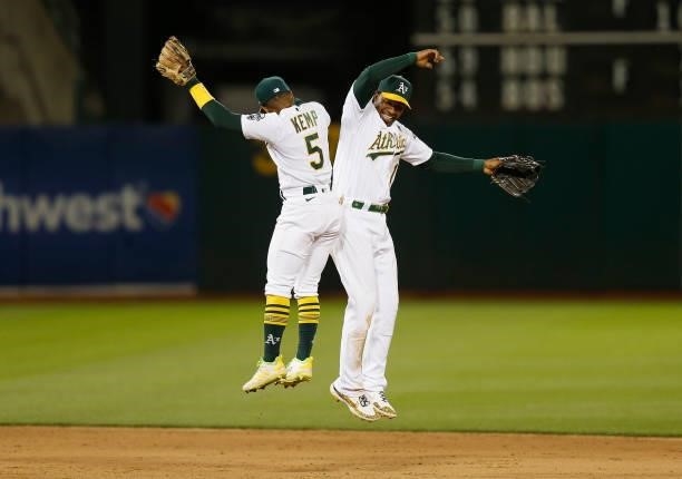 Tony Kemp and Elvis Andrus of the Oakland Athletics celebrate after a win against the Arizona Diamondbacks at RingCentral Coliseum on June 08, 2021...