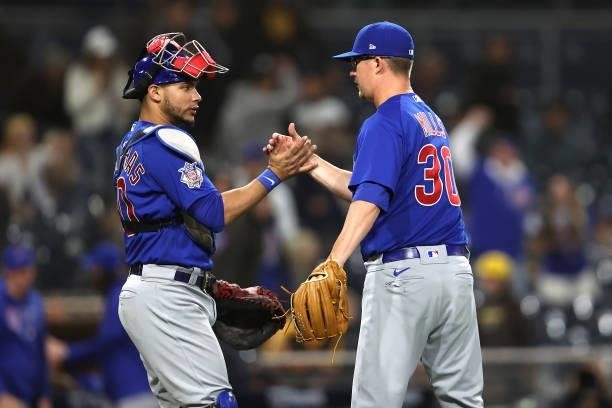 Alec Mills is congratulated by Willson Contreras of the Chicago Cubs after defeating the San Diego Padres 7-1 in a game at PETCO Park on June 08,...
