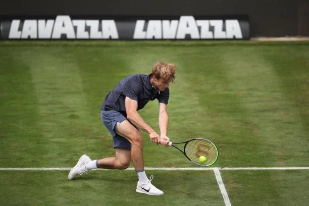 Rudolf Molleker plays a backhand in his match against Marin Cilic of Croatia during day 2 of the MercedesCup at Tennisclub Weissenhof on June 08,...