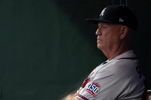 Manager Brian Snitker of the Atlanta Braves looks on from the dugout against the Philadelphia Phillies at Citizens Bank Park on June 8, 2021 in...