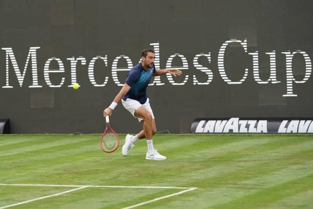 Marin Cilic of Croatia plays a backhand in his match against Rudolf Molleker of Germany during day 2 of the MercedesCup at Tennisclub Weissenhof on...