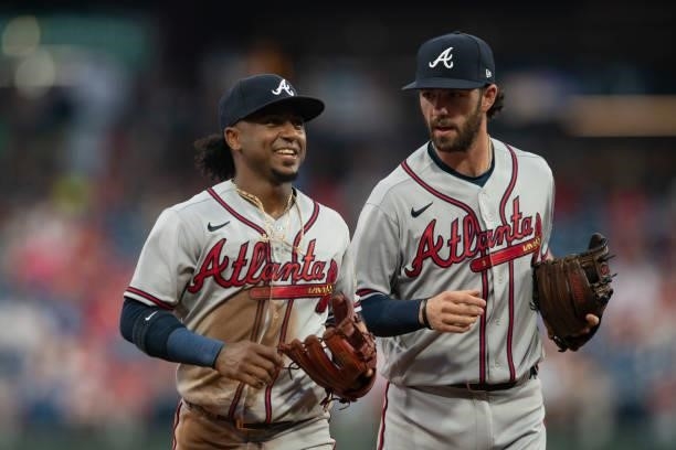 Ozzie Albies and Dansby Swanson of the Atlanta Braves make their way to the dugout against the Philadelphia Phillies at Citizens Bank Park on June 8,...
