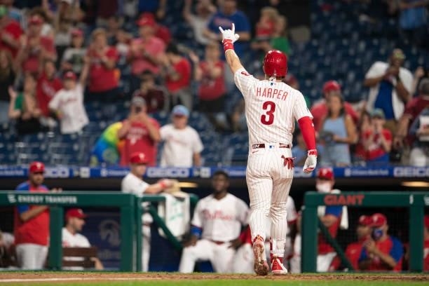 Bryce Harper of the Philadelphia Phillies reacts after hitting a solo home run in the bottom of the fourth inning against the Atlanta Braves at...