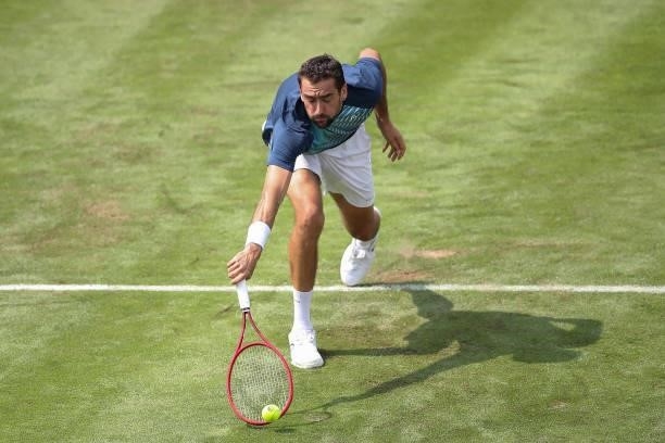 Marin Cilic plays a backhand in his match against Rudolf Molleker of Germany during day 2 of the MercedesCup at Tennisclub Weissenhof on June 08,...