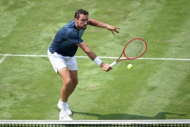 Marin Cilic plays a backhand in his match against Rudolf Molleker of Germany during day 2 of the MercedesCup at Tennisclub Weissenhof on June 08,...