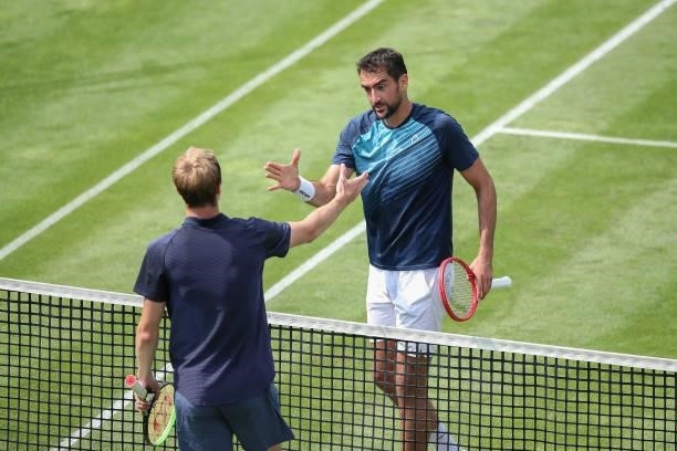 Marin Cilic of Croatia and Rudolf Molleker of Germany shake hands after their match during day 2 of the MercedesCup at Tennisclub Weissenhof on June...