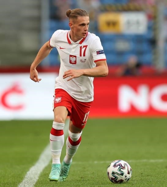 Przemyslaw Placheta of Poland runs with the ball during the international friendly match between Poland and Iceland at Stadion Poznan on June 08,...