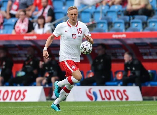 Kamil Glik of Poland runs with the ball during the international friendly match between Poland and Iceland at Stadion Poznan on June 08, 2021 in...