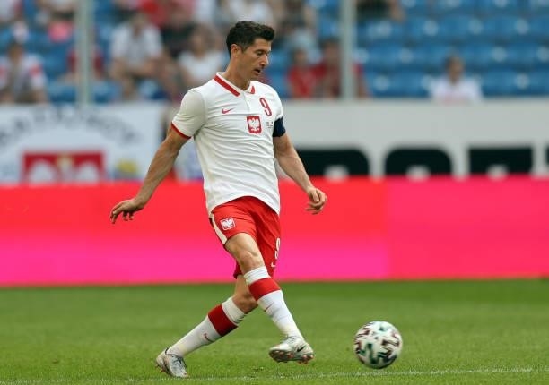 Robert Lewandowski of Poland passes the ball during the international friendly match between Poland and Iceland at Stadion Poznan on June 08, 2021 in...