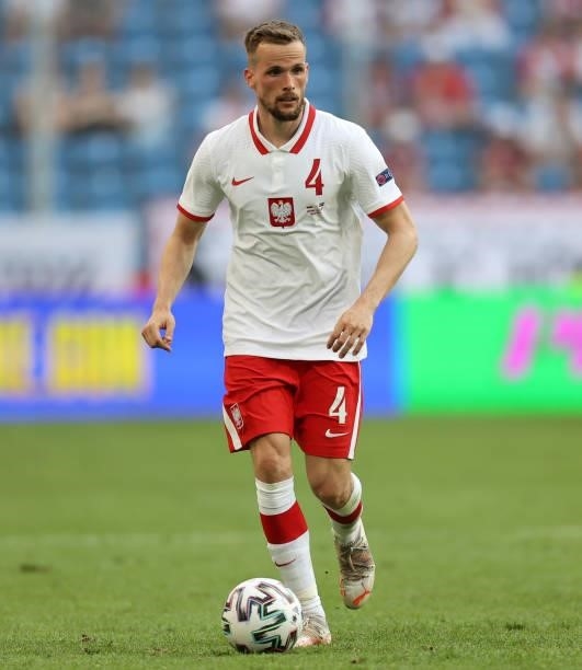 Tomasz Kedziora of Poland runs with the ball during the international friendly match between Poland and Iceland at Stadion Poznan on June 08, 2021 in...