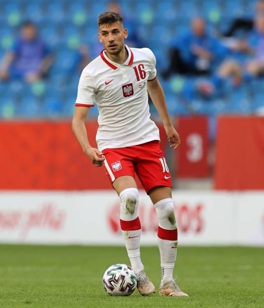 Jakub Moder of Poland runs with the ball during the international friendly match between Poland and Iceland at Stadion Poznan on June 08, 2021 in...
