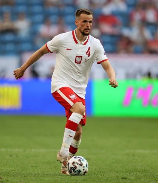 Tomasz Kedziora of Poland runs with the ball during the international friendly match between Poland and Iceland at Stadion Poznan on June 08, 2021 in...