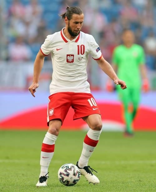 Grzegorz Krychowiak Poland runs with the ball during the international friendly match between Poland and Iceland at Stadion Poznan on June 08, 2021...