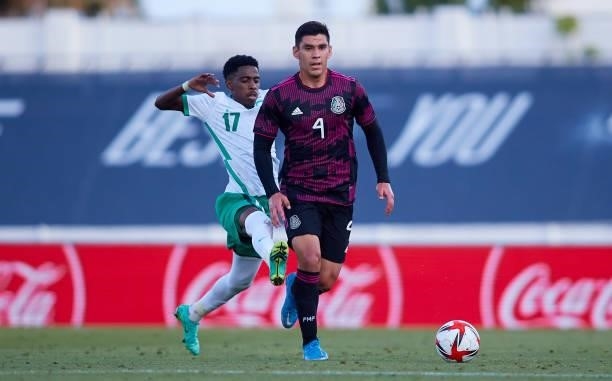 Gilberto Sepúlveda López of Mexico competes for the ball with Aiman Al Kulaif of Saudi Arabia during a International Friendly Match between Mexico...