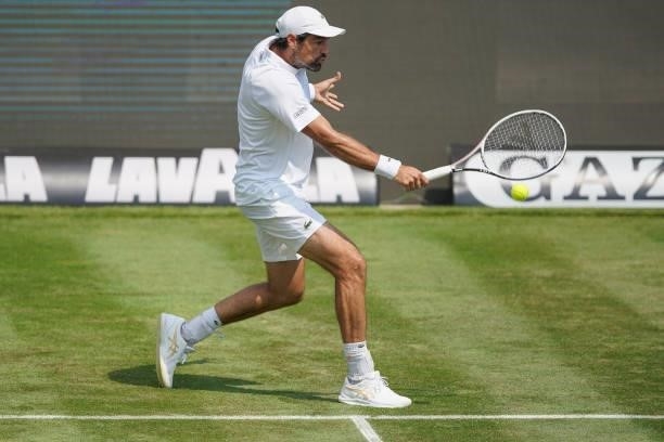 Jeremy Chardy of France plays a backhand during his match against Yannick Hanfmann of Germany during day 3 of the MercedesCup at Tennisclub...