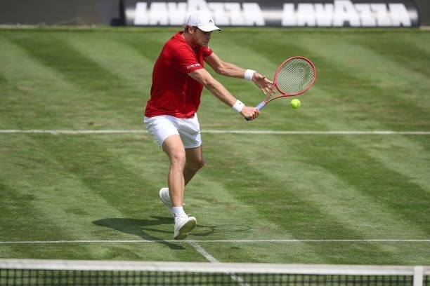 Yannick Hanfmann of Germany plays a backhand during his match against Jeremy Chardy of France during day 3 of the MercedesCup at Tennisclub...
