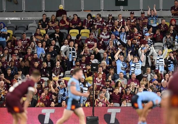 Blues supporters celebrate after winning game one of the 2021 State of Origin series between the New South Wales Blues and the Queensland Maroons at...