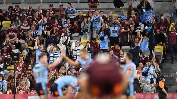 Blues supporters celebrate after winning game one of the 2021 State of Origin series between the New South Wales Blues and the Queensland Maroons at...