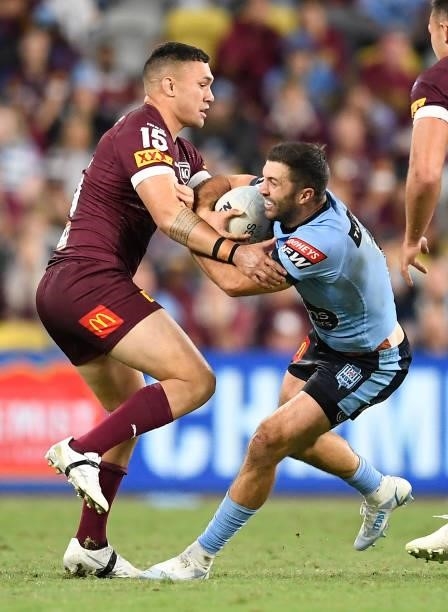 James Tedesco of the Blues is tackled by Jaydn Su'A of the Maroons during game one of the 2021 State of Origin series between the New South Wales...